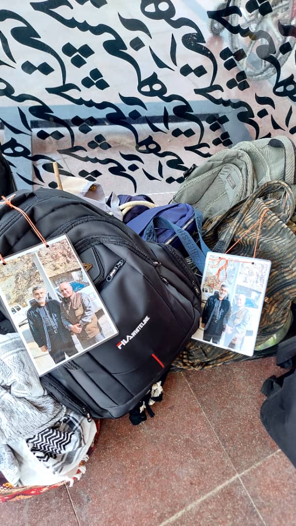 IMG 20250806 WA0069 تصویر شهید حاجی زاده و محیط‌بان شهید دیده‌بان بر کوله‌های زائران اربعین بهبهان