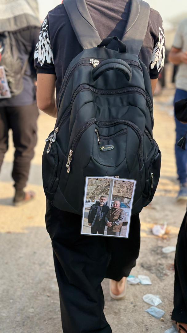 IMG 20250806 WA0076 تصویر شهید حاجی زاده و محیط‌بان شهید دیده‌بان بر کوله‌های زائران اربعین بهبهان